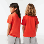 Lacoste חולצת טריקו מבד כותנה עם צווארון צווארון DZ4D0D3022 כתום 02k ילדים - Image 3