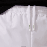 Lacoste מכנסי אימונית מבד קל משקל DZ4D0D549 לבן 001 גברים - Image 10