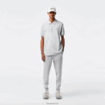 Lacoste מכנסי אימונית של אימונית בגזרת כותנה מחוסמת בגזרה דקיקה DZ4D0D1006 chine אפור cca גברים