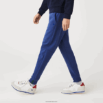 Lacoste מכנסי אימונית של אימונית בגזרת כותנה מחוסמת בגזרה דקיקה DZ4D0D1140 כחול chine hjd גברים - Image 4