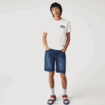 Lacoste מכנסי ברמודה מכותנה ג'ינס נמתחת בגזרה דקיקה DZ4D0D1644 כחול mk9 גברים