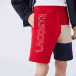 Lacoste מכנסי ברמודה קצרים בצבע בלוק צמר DZ4D0D1558 אדום בז' כחול כהה 1fu גברים - Image 2