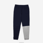 Lacoste מכנסי ג'וגינג מבד כותנה מפורק מורשת DZ4D0D1206 כחול כהה 166 גברים - Image 6