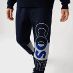 Lacoste מכנסי ג'וגינג מבד כותנה מפורק מורשת DZ4D0D1206 כחול כהה 166 גברים - Image 7