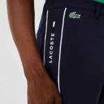 Lacoste מכנסי גולף קלים למתוח ספורט DZ4D0D1640 כחול כהה לבן 525 גברים - Image 2