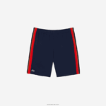 Lacoste מכנסי טניס קצרים מפוליאסטר ממוחזר DZ4D0D426 כחול כהה אדום כתום xii גברים - Image 4