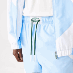 Lacoste מכנסי טרנינג גרפי מורשת DZ4D0D1071 כחול לבן e7b גברים - Image 4