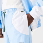 Lacoste מכנסי טרנינג גרפי מורשת DZ4D0D1071 כחול לבן e7b גברים - Image 7