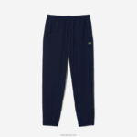 Lacoste מכנסי טרנינג דוחי מים בכושר רגיל DZ4D0D332 כחול כהה 166 גברים - Image 4
