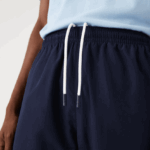 Lacoste מכנסי טרנינג דוחי מים בכושר רגיל DZ4D0D332 כחול כהה 166 גברים - Image 6