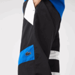 Lacoste מכנסי טרנינג דוחי מים טלאים DZ4D0D1105 שחור כחול לבן se1 גברים - Image 2