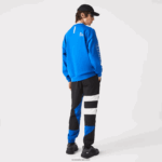 Lacoste מכנסי טרנינג דוחי מים טלאים DZ4D0D1105 שחור כחול לבן se1 גברים - Image 3