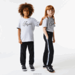 Lacoste מכנסי טרנינג להקות מודפסות DZ4D0D3223 שחור כחול 985 ילדים
