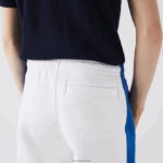 Lacoste מכנסי טרנינג להקות ניגודיות DZ4D0D1060 לבן כחול lmq גברים - Image 6