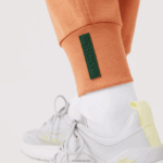 Lacoste מכנסי טרנינג מכותנה DZ4D0D2405 כתום wwc נשים - Image 5