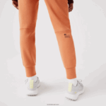 Lacoste מכנסי טרנינג מכותנה DZ4D0D2405 כתום wwc נשים - Image 6
