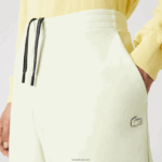 Lacoste מכנסי טרנינג ממותגים בגזרה דקיקה DZ4D0D974 צהוב 6gd גברים - Image 2