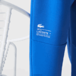 Lacoste מכנסי טרנינג ממותגים בגזרה דקיקה DZ4D0D975 כחול k1q גברים - Image 8