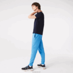 Lacoste מכנסי טרנינג פליסה בגזרה מחודדת DZ4D0D1086 כחול 4xa גברים - Image 2