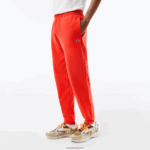 Lacoste מכנסי טרנינג פליסה בגזרה מחודדת DZ4D0D374 כתום 02k גברים - Image 2