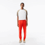 Lacoste מכנסי טרנינג פליסה בגזרה מחודדת DZ4D0D374 כתום 02k גברים