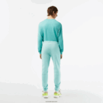 Lacoste מכנסי טרנינג פליסה בגזרה מחודדת DZ4D0D345 מנטה lgf גברים - Image 3