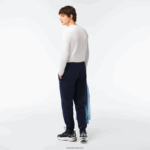Lacoste מכנסי טרנינג פליסה בגזרה מחודדת DZ4D0D348 כחול כהה 166 גברים - Image 3