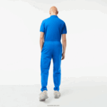 Lacoste מכנסי טרנינג פליסה בגזרה מחודדת DZ4D0D357 כחול kxb גברים - Image 3