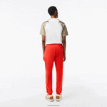 Lacoste מכנסי טרנינג פליסה בגזרה מחודדת DZ4D0D374 כתום 02k גברים - Image 3