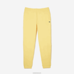 Lacoste מכנסי טרנינג פליסה בגזרה מחודדת DZ4D0D349 צהוב 107 גברים - Image 4