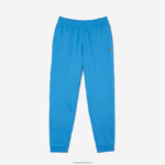 Lacoste מכנסי טרנינג פליסה בגזרה מחודדת DZ4D0D1086 כחול 4xa גברים - Image 5