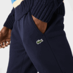 Lacoste מכנסי טרנינג פליסה בגזרה מחודדת DZ4D0D348 כחול כהה 166 גברים - Image 7