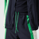 Lacoste מכנסי טרנינג קל משקל דוחה מים DZ4D0D1180 כחול נייבי לבן ירוק 19v גברים - Image 7