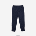 Lacoste מכנסי טרנינג קל משקל עם צינורות DZ4D0D3211 כחול כהה לבן 525 בנים - Image 2