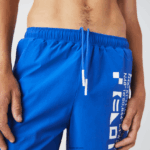 Lacoste מכנסי ים בהדפס ימי DZ4D0D1661 כחול לבן 7 lc גברים - Image 5