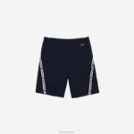 Lacoste מכנסי פליסה קצרים מוברש להקות מודפסות DZ4D0D1496 כחול כהה 166 גברים - Image 5