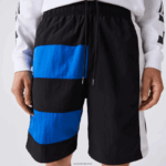 Lacoste מכנסיים קצרים עם אפקט טלאים בלוק צבעוני DZ4D0D1500 שחור כחול לבן se1 גברים - Image 7