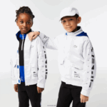 Lacoste מעיל דוחה מים ברדס נשלף DZ4D0D3240 לבן כחול שחור 9cw ילדים