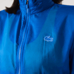 Lacoste מעיל ספורטיבי דוחה מים שניתן לארוז DZ4D0D2618 כחול k1q נשים - Image 4