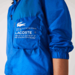 Lacoste מעיל ספורטיבי דוחה מים שניתן לארוז DZ4D0D2618 כחול k1q נשים - Image 7